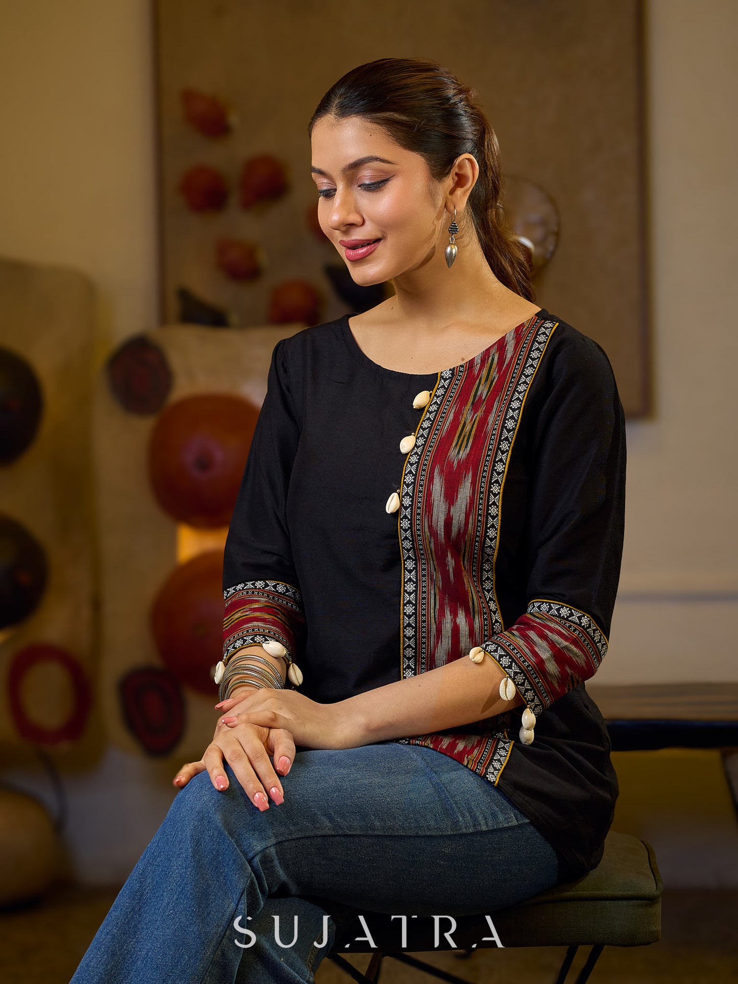 Sleek Black Cotton Silk Top Adorned with Ikat Borders and Exquisite Cowrie Embellishments