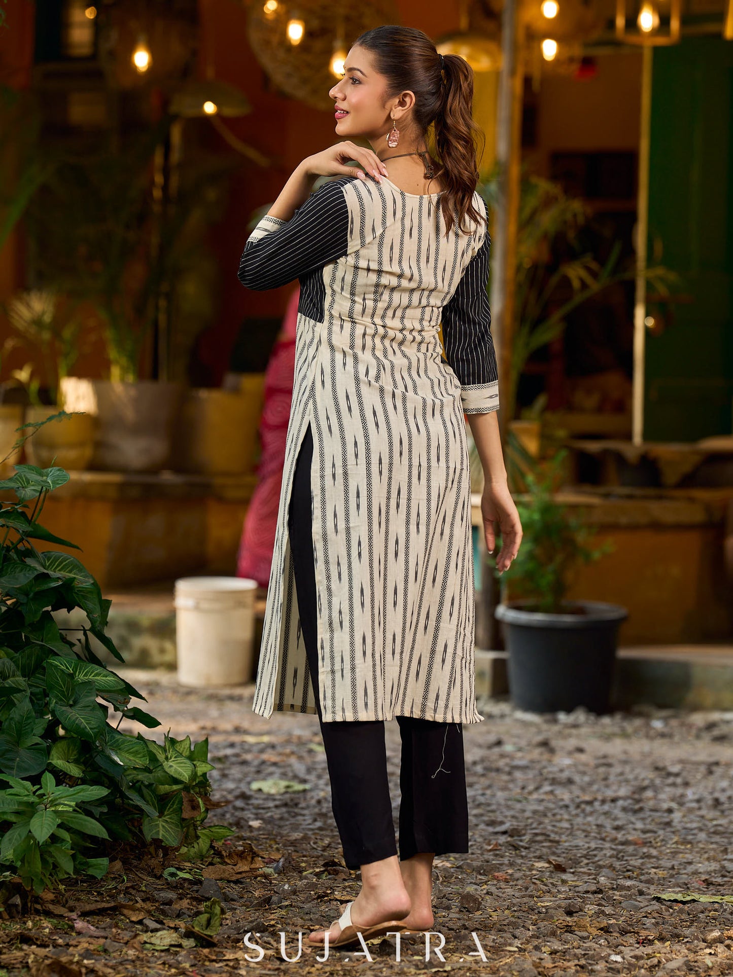 Timeless monochrome Ikat kurta enhanced with stripe details.