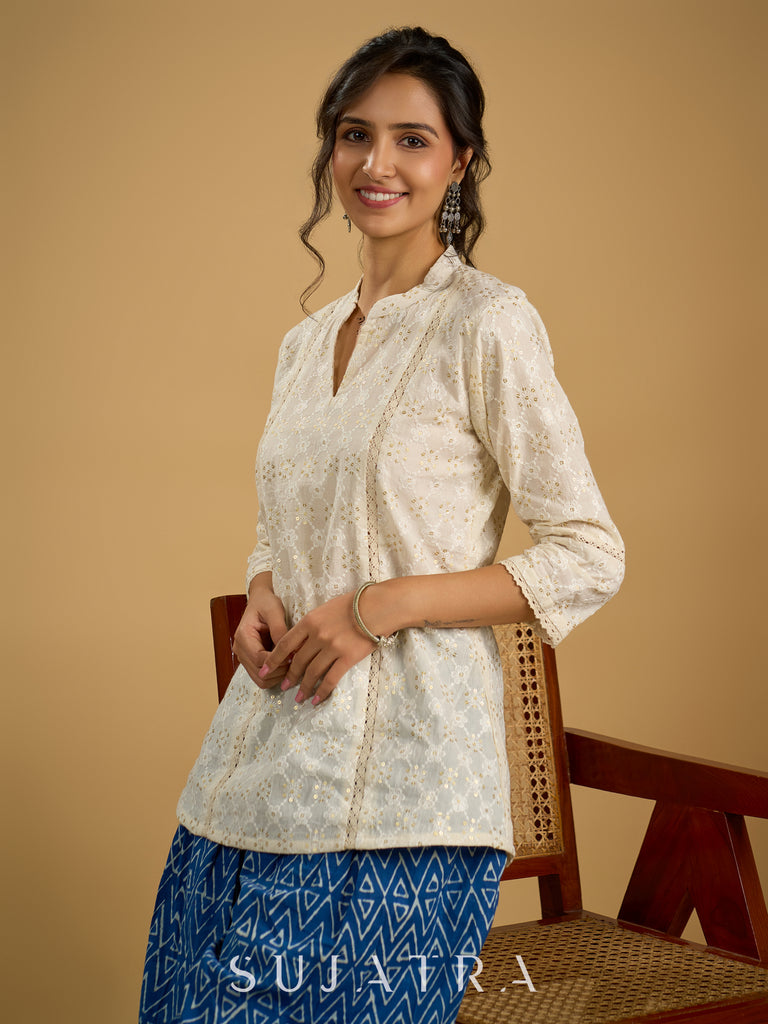 Classic off -white cotton top featuring delicate hakoba embroidery work.
