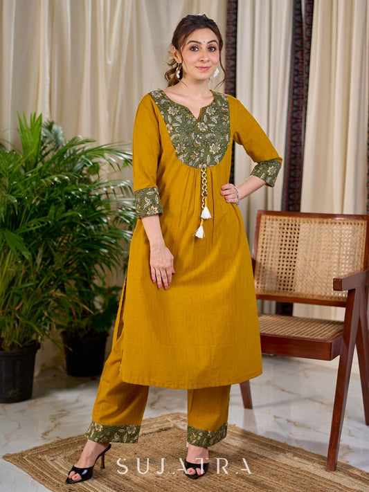 Vibrant Mustard Cotton Kurta with Olive Floral Print Yoke and Statement Tassel Embellishment