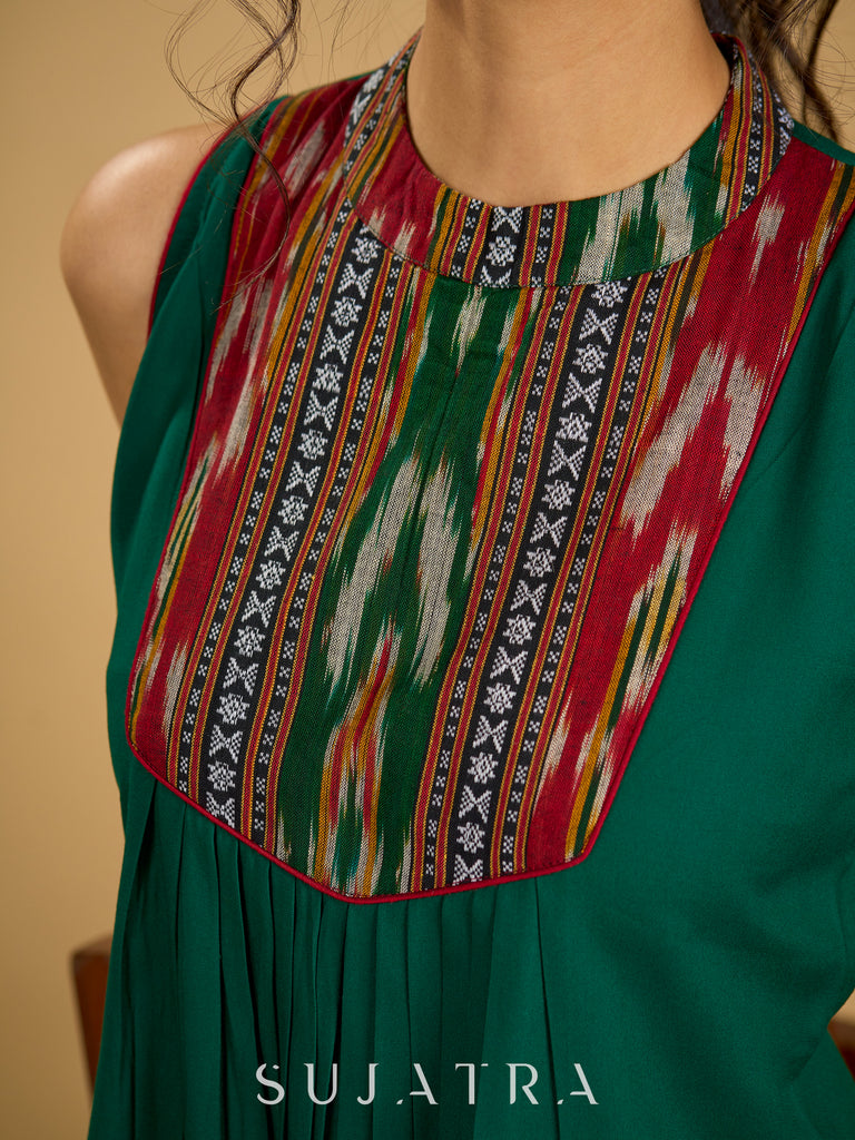 Elegant rayon green sleeveless top with ikat accents.
