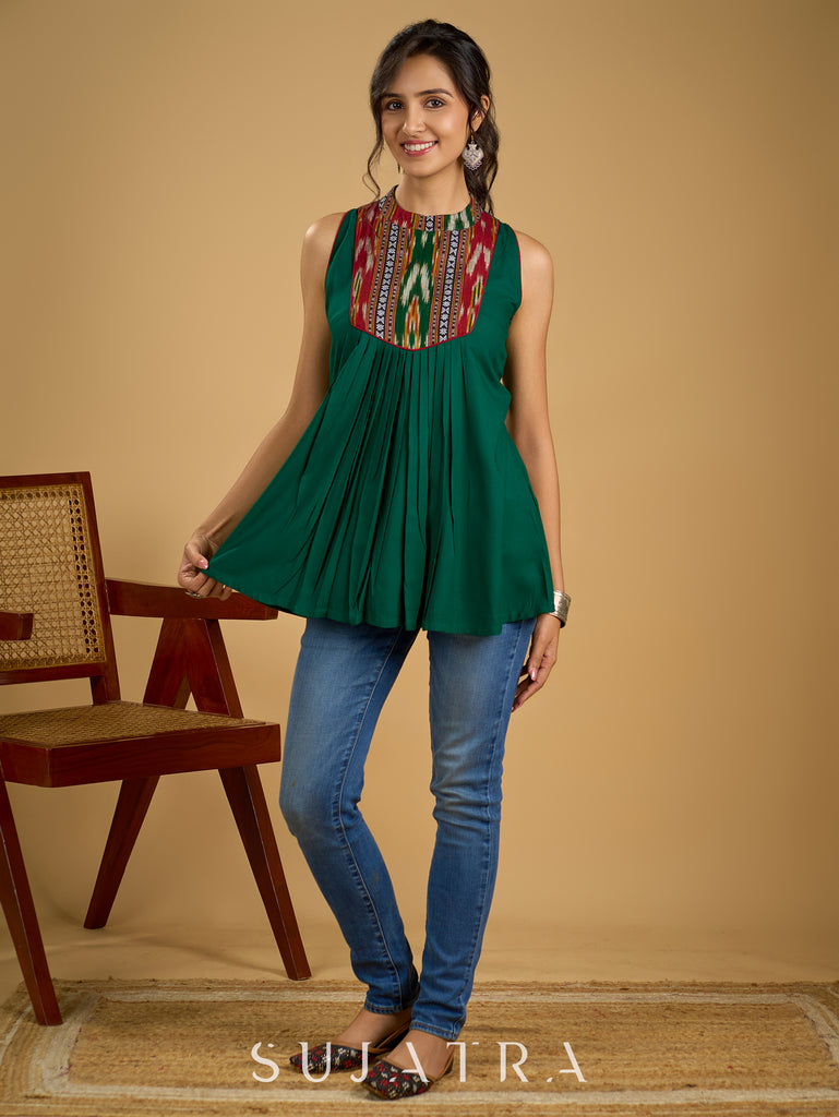 Elegant rayon green sleeveless top with ikat accents.