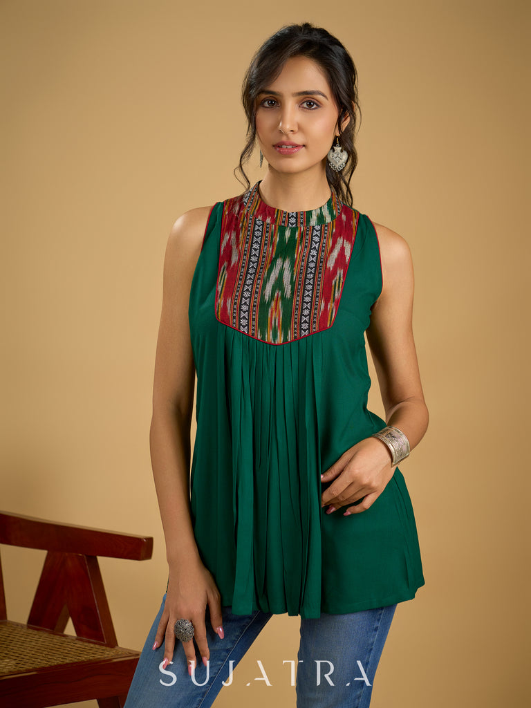 Elegant rayon green sleeveless top with ikat accents.