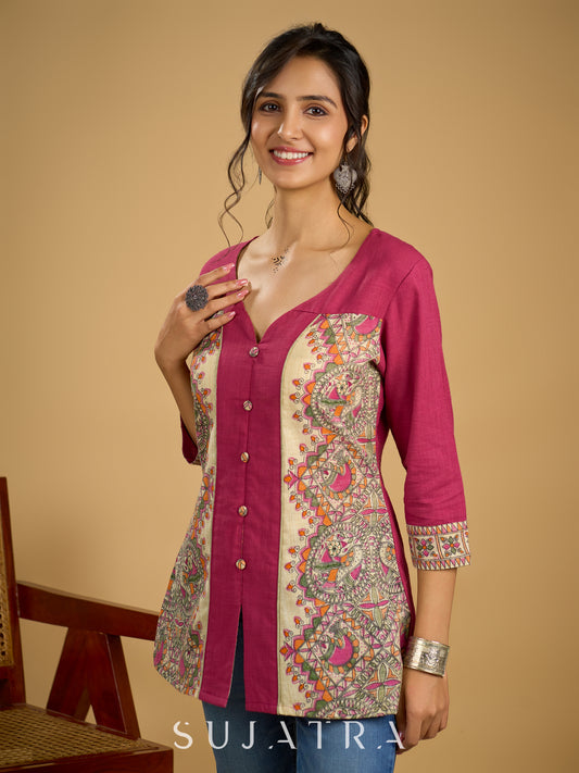 Madhubani print add charm to this magenta cotton top.