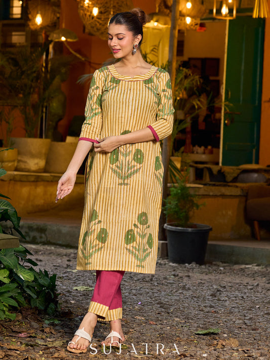 Handcrafted mustard kurta with stripe–floral print and magenta accents.