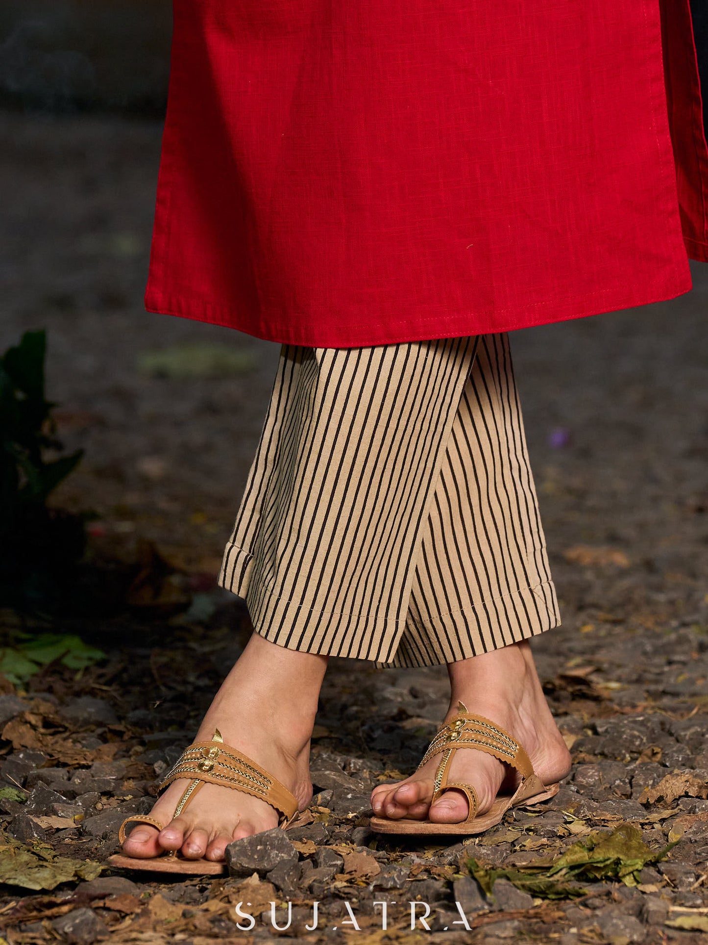 Elegant red kurta featuring a V-shaped striped neck panel