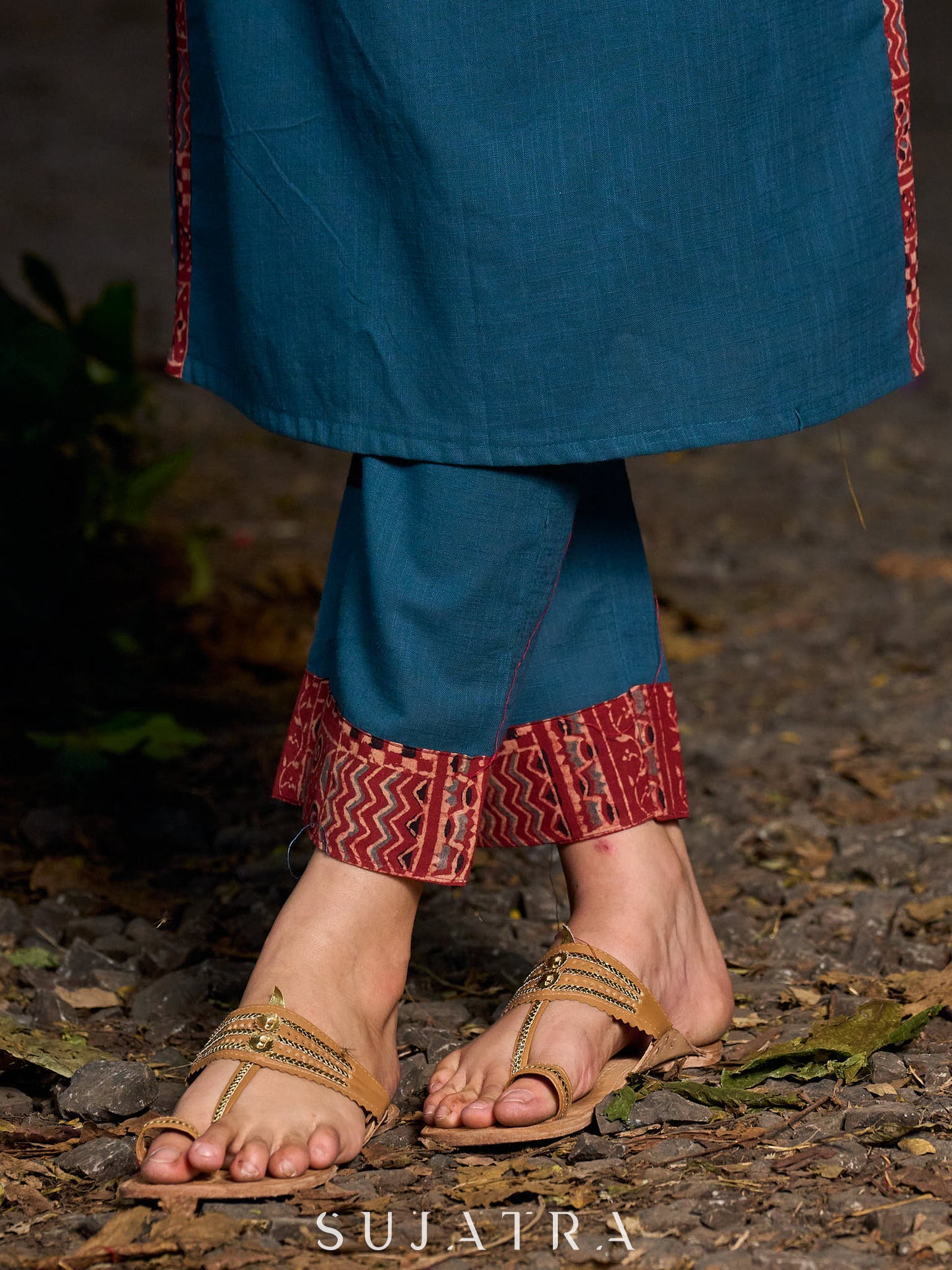 Chic teal pants featuring a bold Ajrakh contrast border.