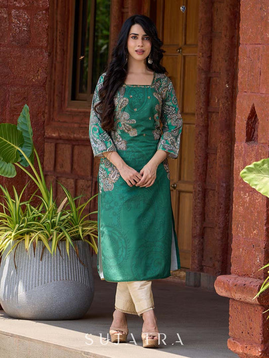 Statement green paisley kurta with detailed hand embroidery beautifully enhancing the print.