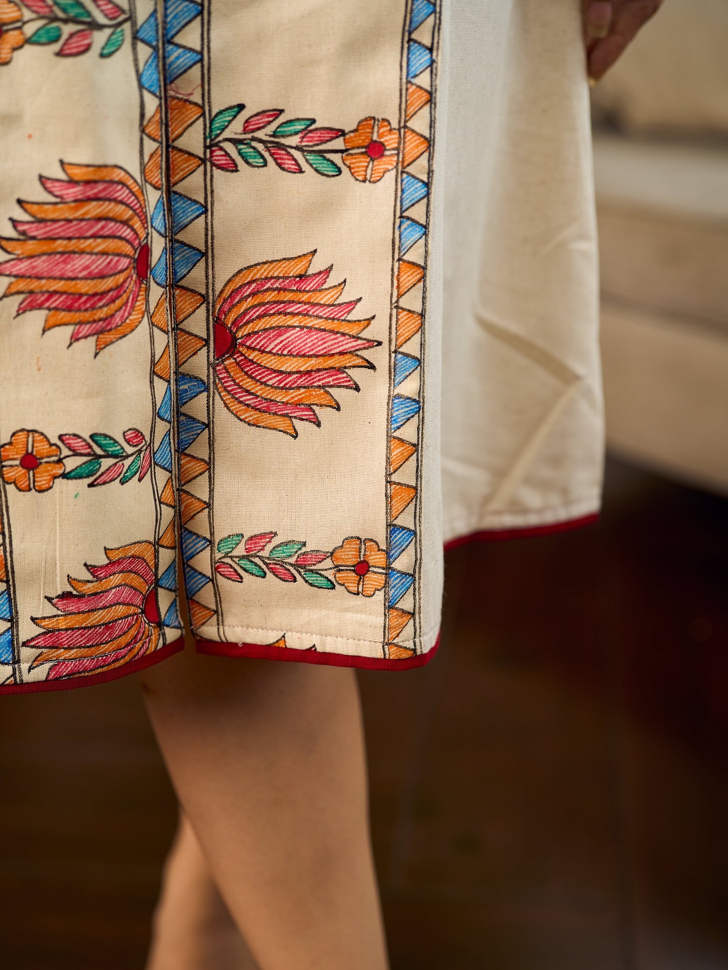 Artisan-crafted off-white Madhubani dress with beautiful hand-painted motifs and trim.