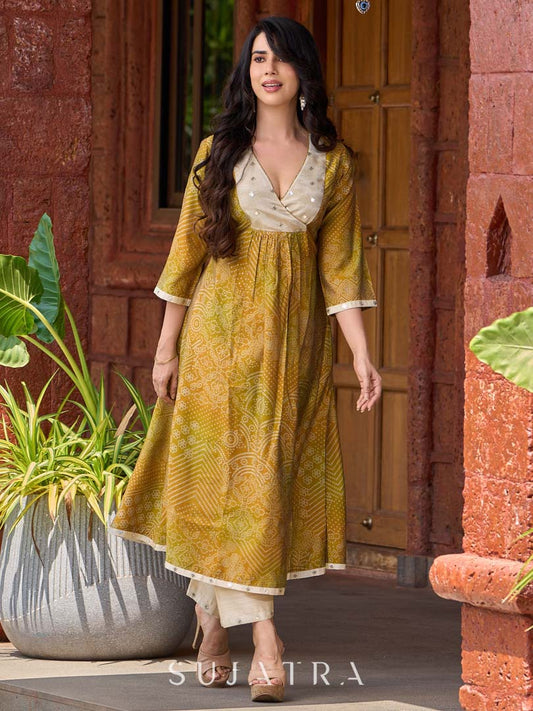 Exquisite yellow Bandhani printed kurta with a delicate off-white tissue overlay and refined accents.
