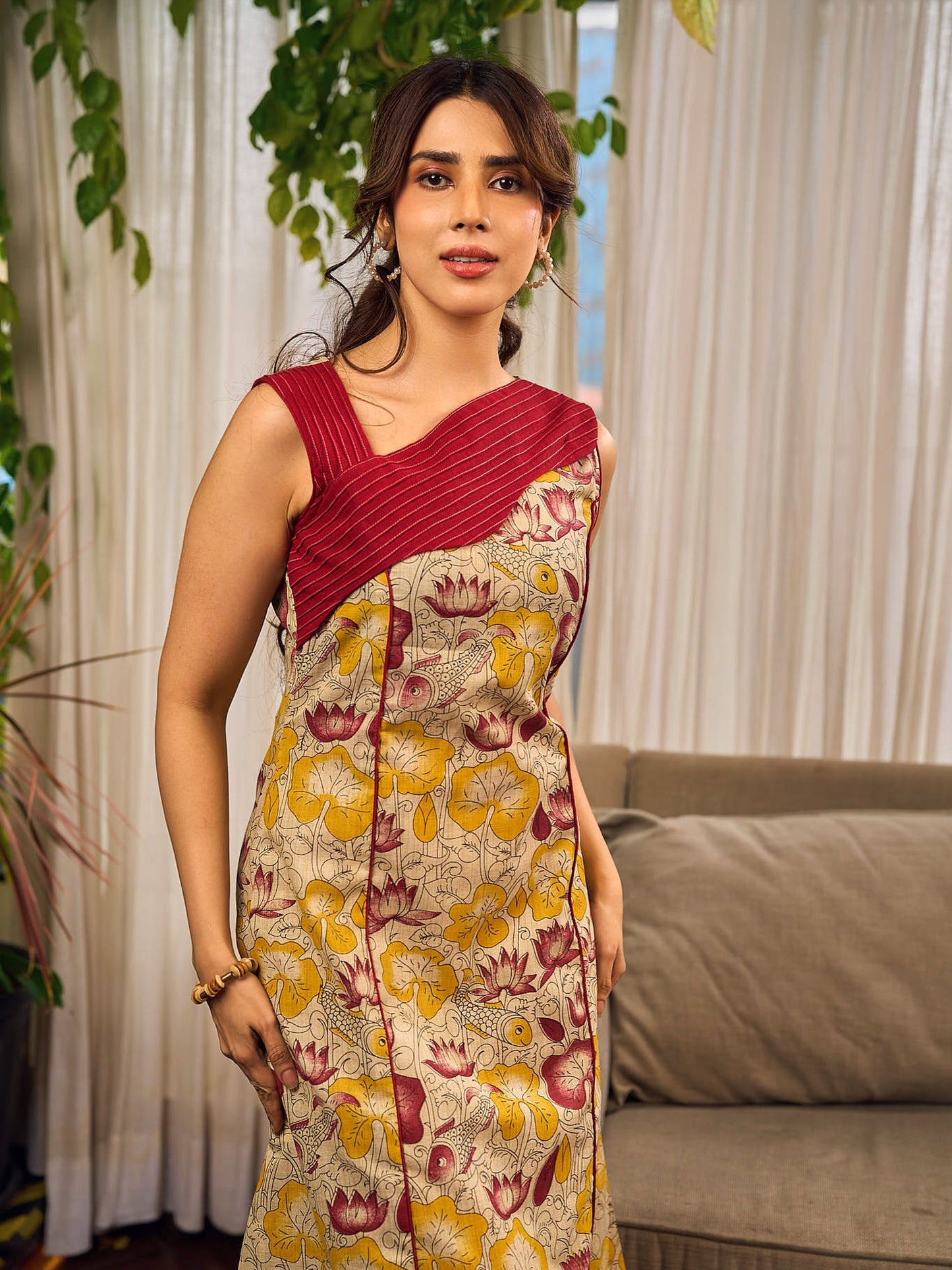 Elegant cream and maroon Madhubani dress featuring sophisticated wavy pintuck flap detailing.