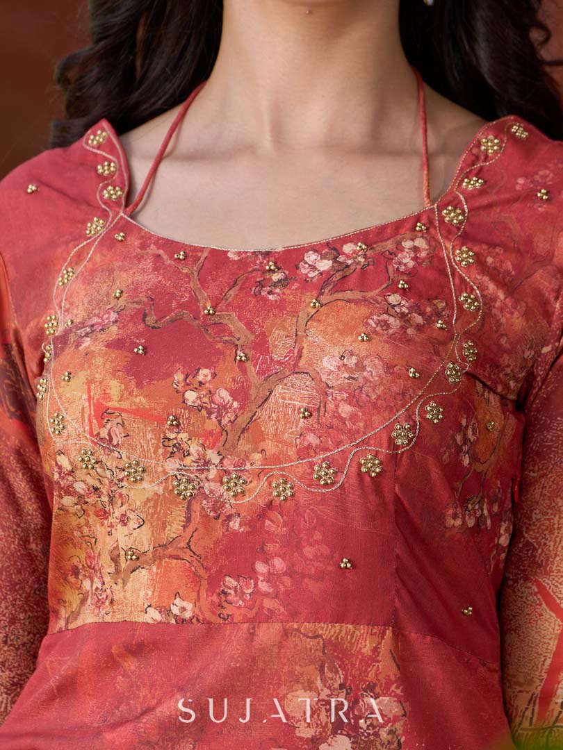 Amber crimson blossom printed kurta with golden pearl handwork on the yoke and dainty tie-up neck details.