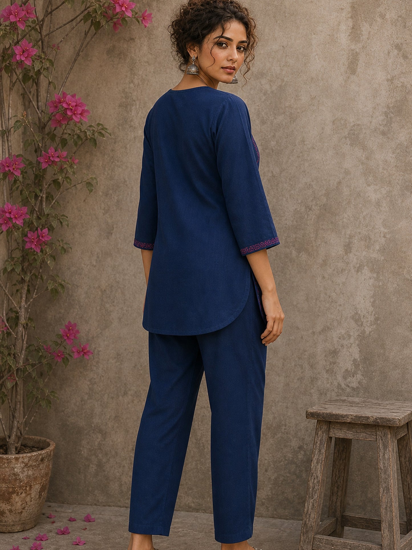 Vibrant navy blue and pink hand block print top features bell sleeves, floral detailing, and rich navy hues for effortless everyday charm.