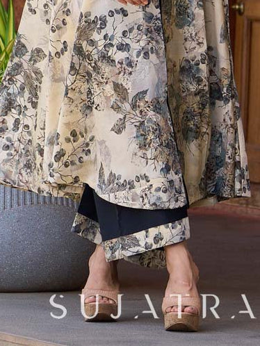 Stylish black flared pants in soft rayon, accented with a refined black–white printed border.