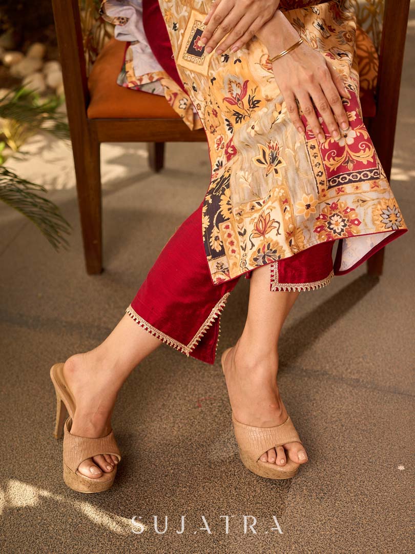 Elegant maroon cotton silk straight slit pants with delicate gota patti detailing at the slit.