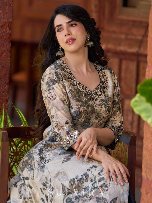 Elegant black–white floral kurta featuring a graceful bias silhouette, intricate mirror embroidery on the neck and sleeves, and a sweetheart neckline.