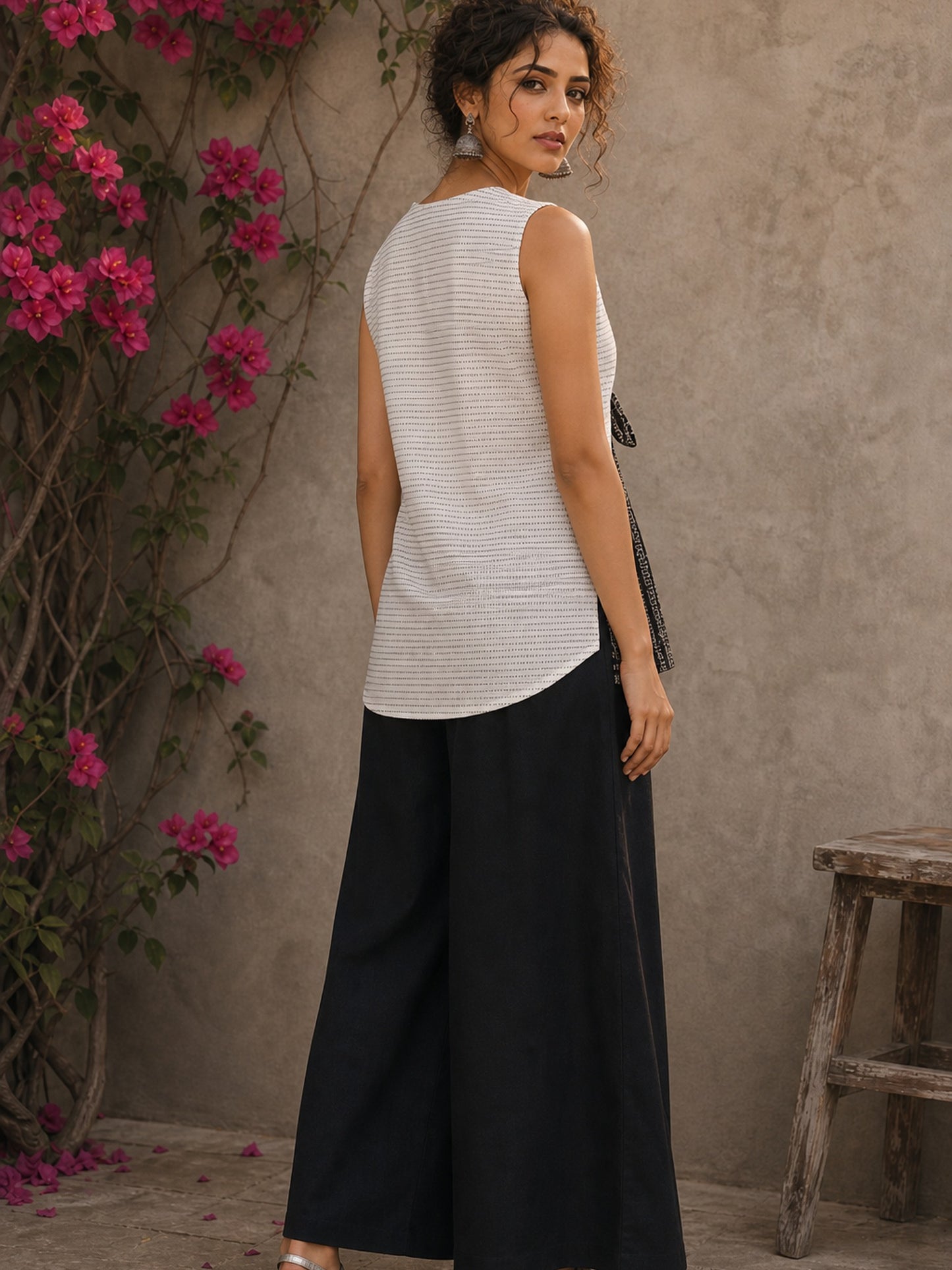 White cotton wrap-style top featuring contrast block print mantra borders, side tie, and modern silhouette.
