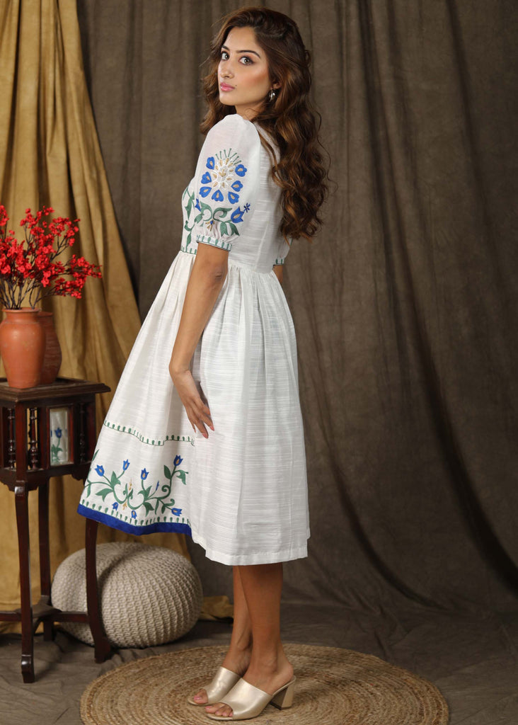 Stylish classic white cotton silk gathered dress with elegant embroidery paired with chanderi sleeves