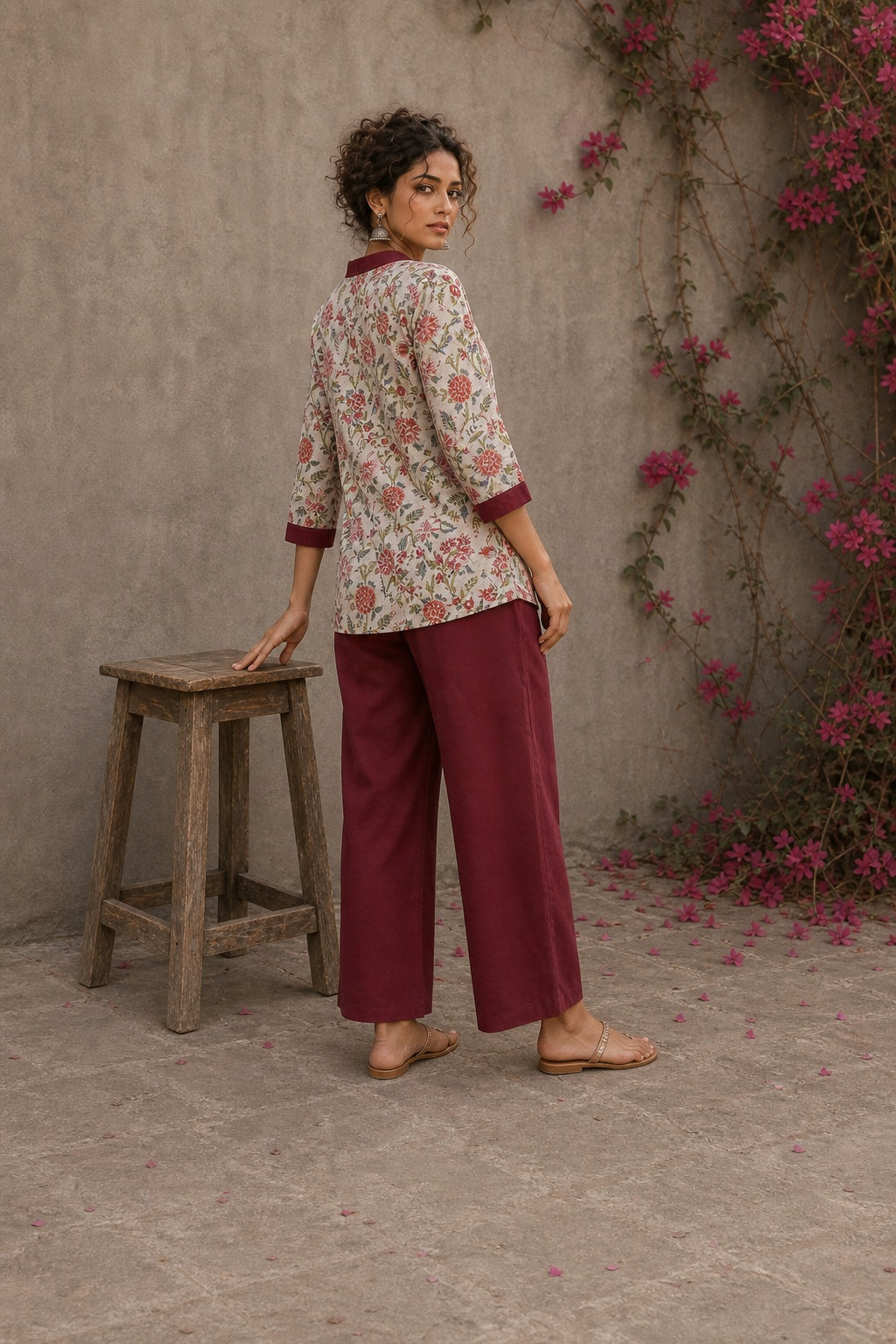 Soft white floral cotton top finished with maroon cuffs, pleated collar, and delicate feminine elegance.