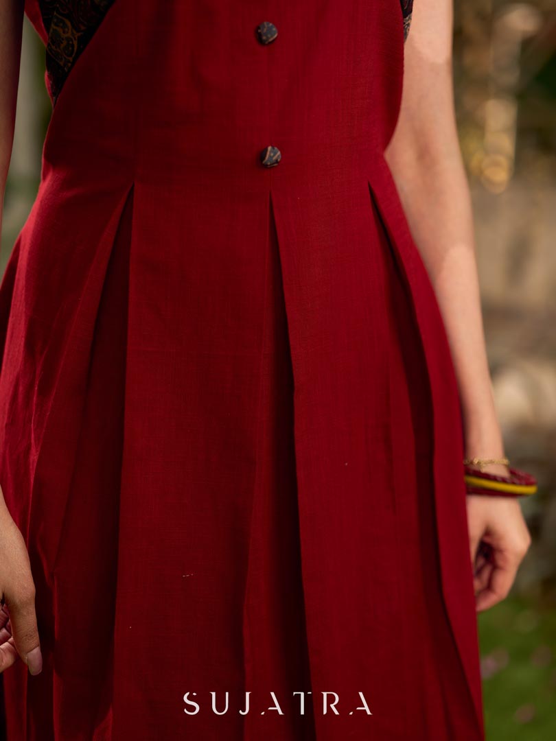 Statement sleeveless Ajrakh dress elevated with a folded collar and graceful maroon pleats.