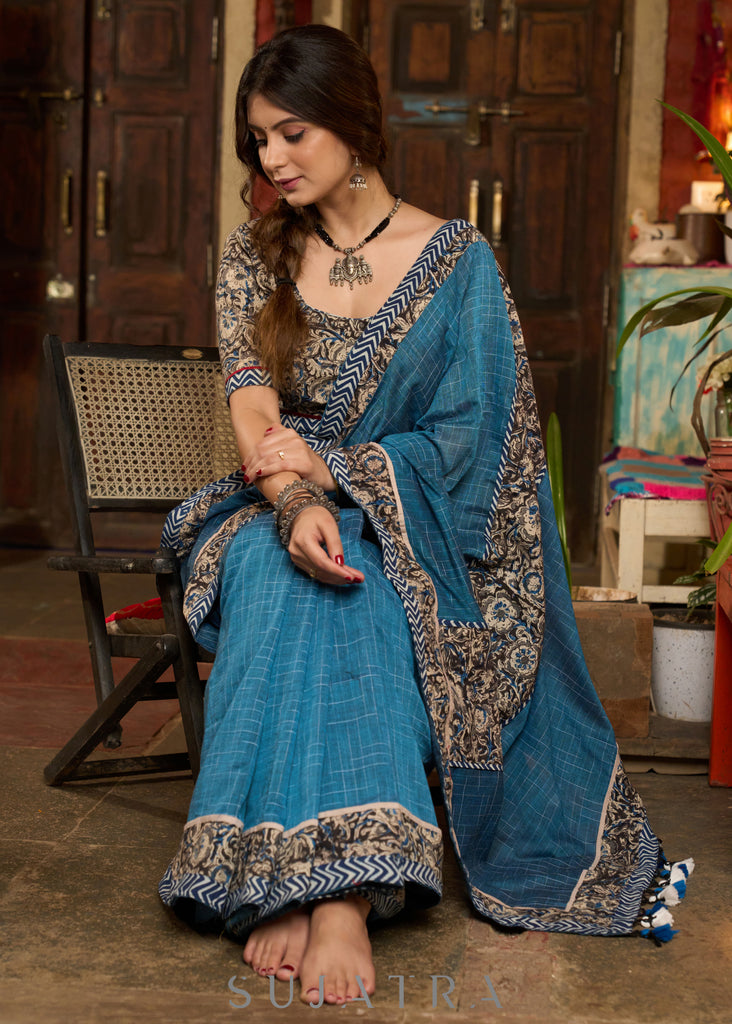 Exclusive Teal blue cotton saree highlighted with kalamkari and indigo borders