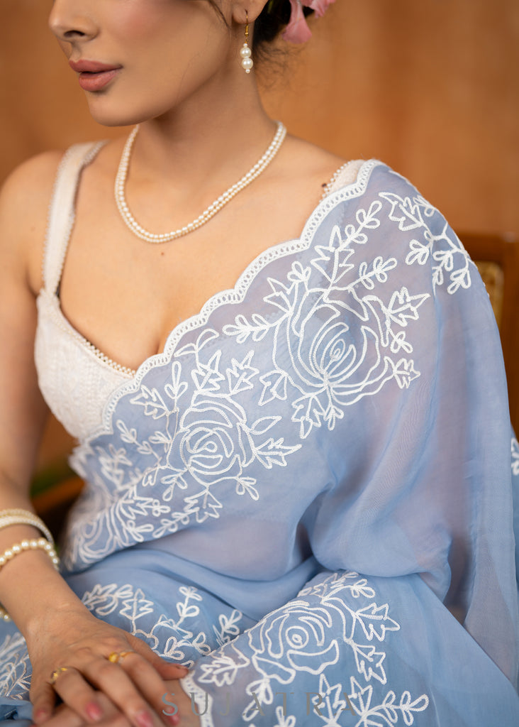 Elegant Powder Blue Organza Saree Highlighted With Overall Intricate Floral Embroidery