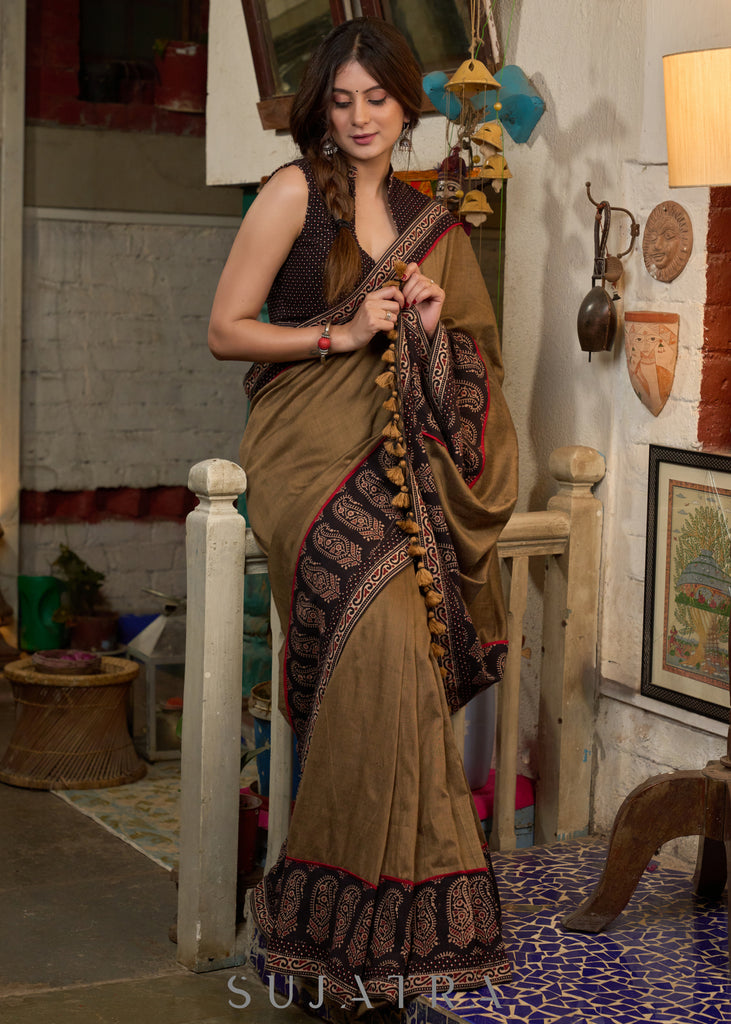 Gracious coffee brown cotton saree with ajrakh combination highlighted with side pocket