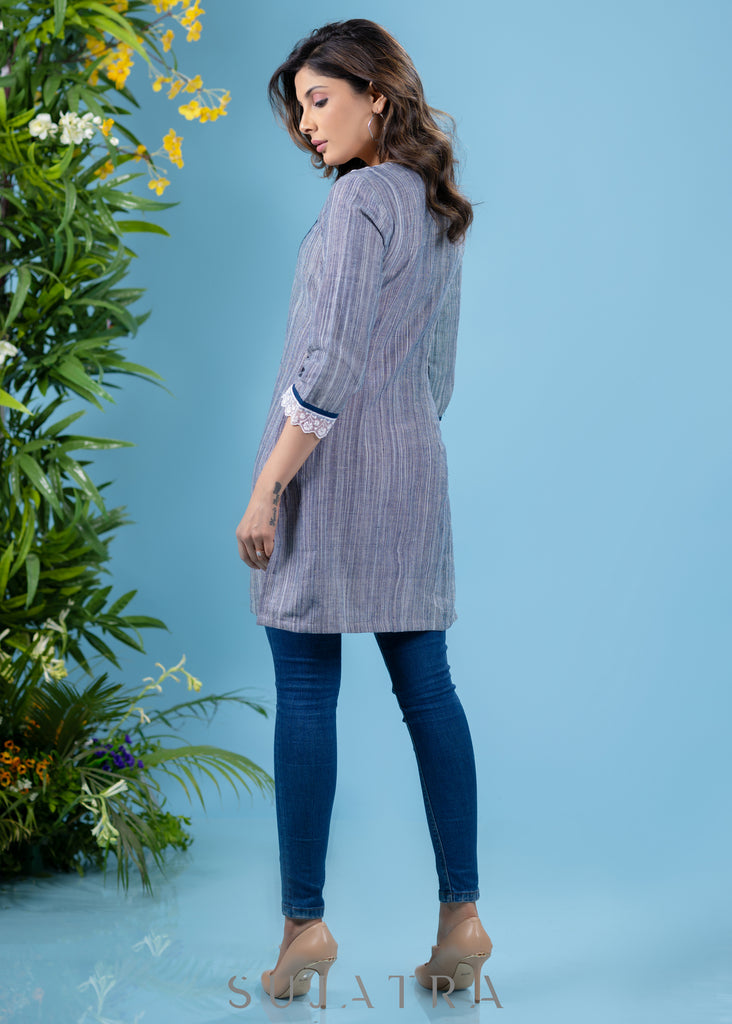 Stylish sky blue textured cotton tunic highlighted with beautiful lace