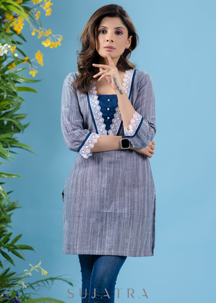 Stylish sky blue textured cotton tunic highlighted with beautiful lace