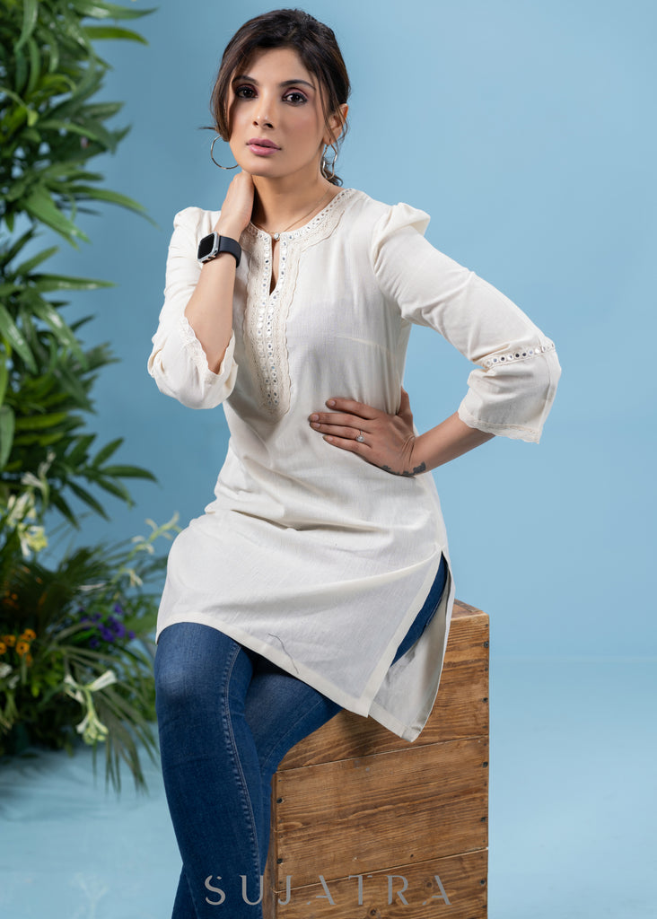 Subtle pearl white cotton tunic highlighted with matching mirror lace