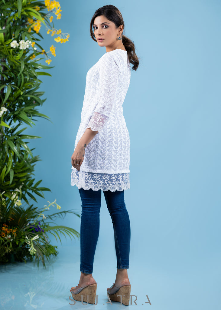 Classy ivory cotton self embroidered tunic highlighted with beautiful lace