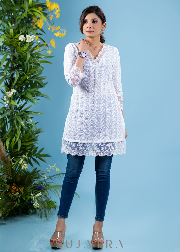 Classy ivory cotton self embroidered tunic highlighted with beautiful lace