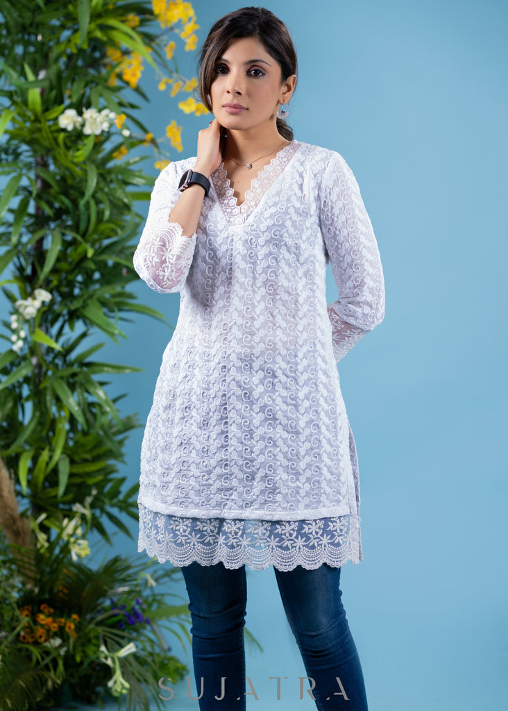 Classy ivory cotton self embroidered tunic highlighted with beautiful lace