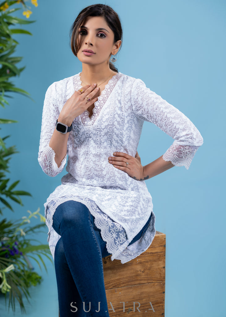 Classy ivory cotton self embroidered tunic highlighted with beautiful lace