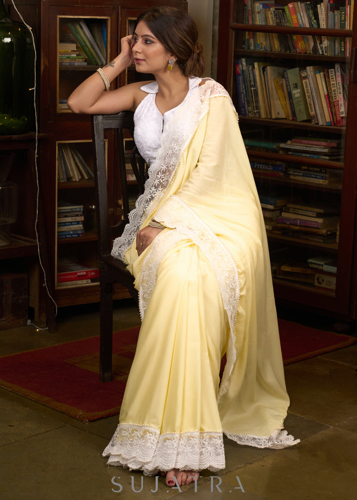 Gracious pastel yellow modal cotton saree highlighted with beautiful laces