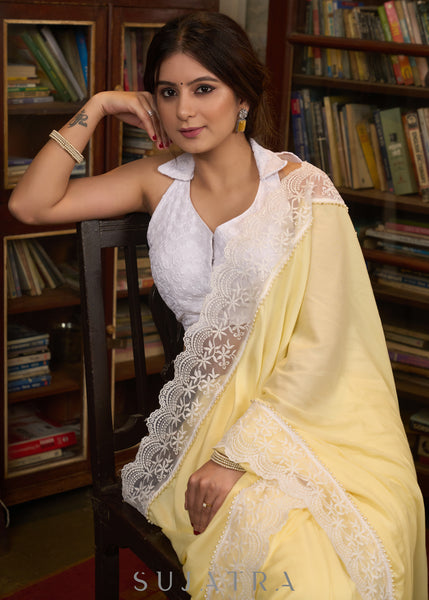 Gracious pastel yellow modal cotton saree highlighted with beautiful laces