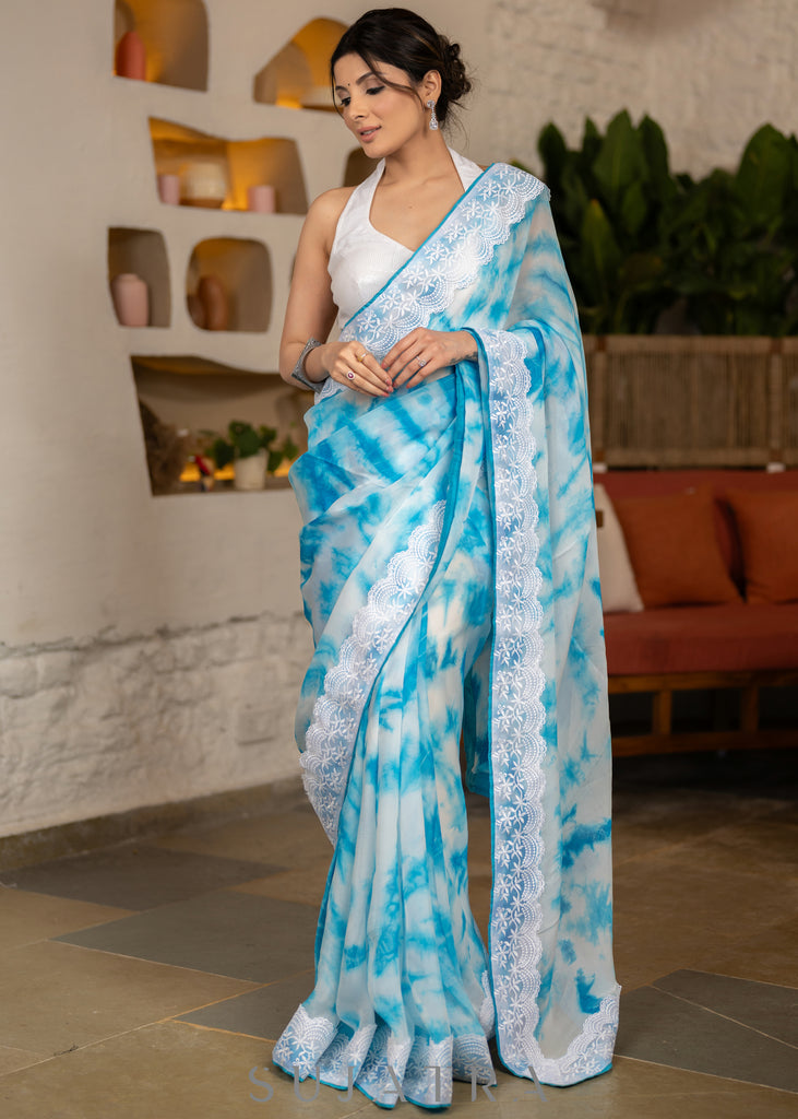 Beautiful Sky Blue Tie & Dye Organza Saree Highlighted With Matching Crochet Lace