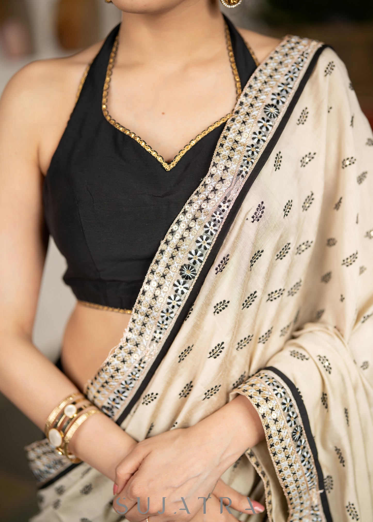 Elegant Light Beige Cotton Silk Saree With Black Georgette Combination Highlighted With Beautiful Floral Embroidery And Contrast Lace