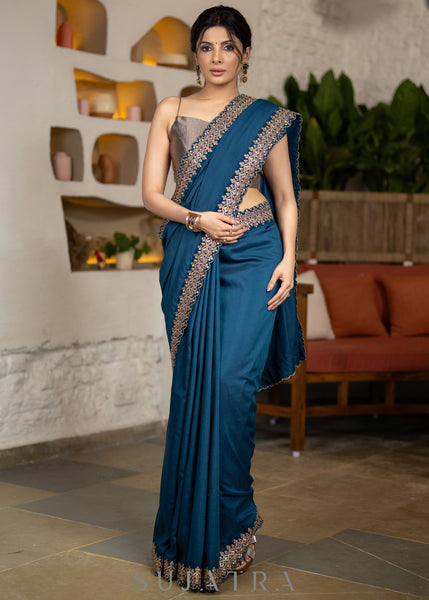 Lustrous Teal Muslin Saree Highlighted With Beautiful Matching Lace