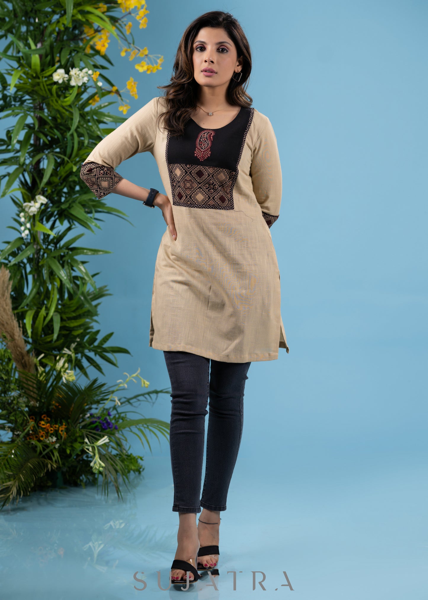 Elegant beige cotton tunic with ajrakh yoke highlighted with applique motif