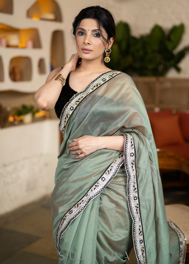 Elegant Sage Green Chanderi Saree Highlighted With Contrast Floral Lace