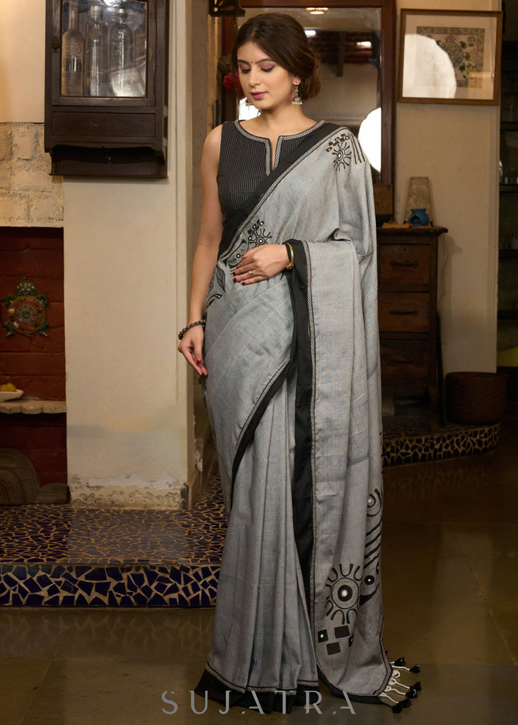 Graceful grey cotton saree with beautiful abstract hand painting highlighted with contrast painted side pocket