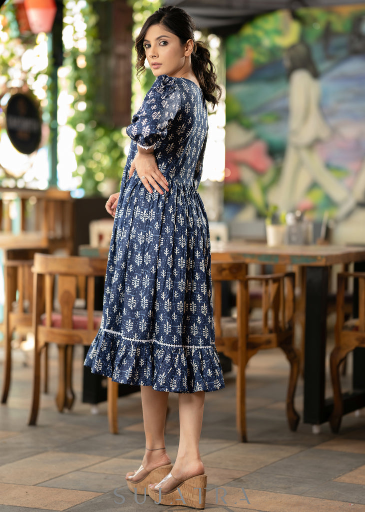 Trendy navy blue floral printed rayon gathered dress highlighted with beautiful lace