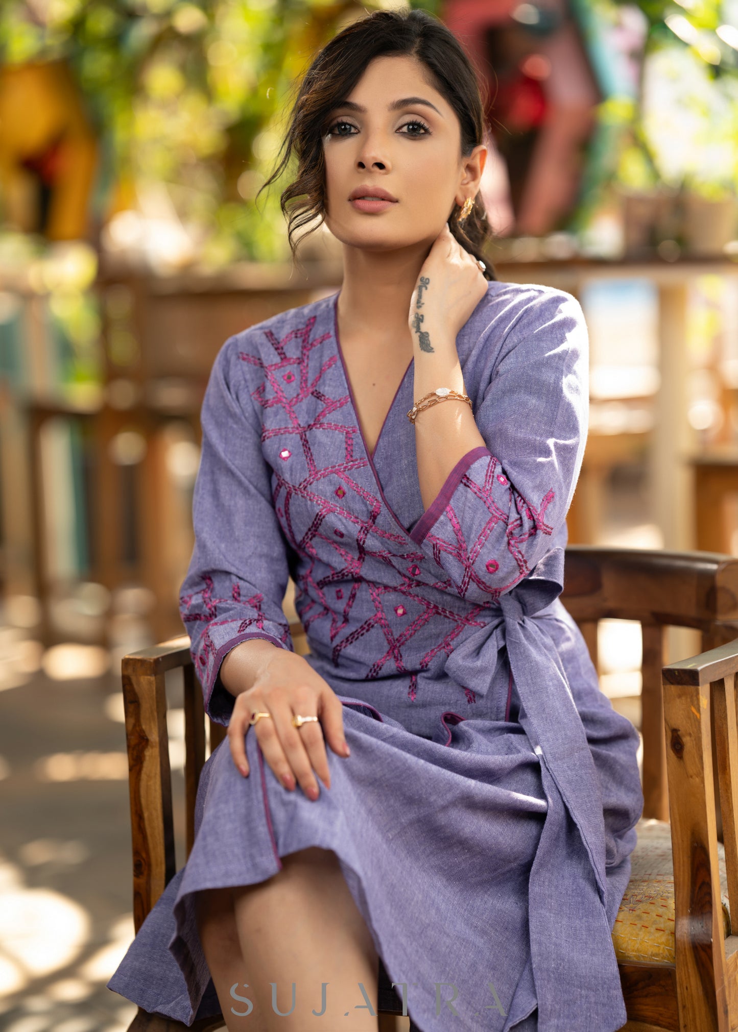 Elegant lilac cotton overlap dress highlighted with contrast embroidery