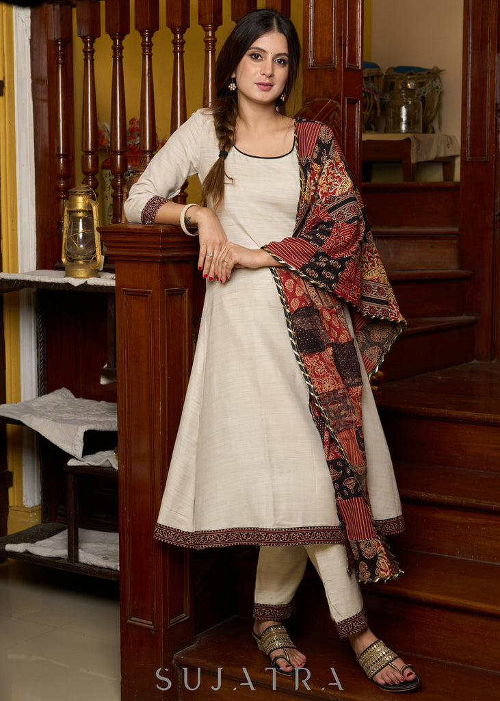 Off-white handloom kurta with contrast ajrakh highlights, paired with complementing pants - Patch work stole Optional