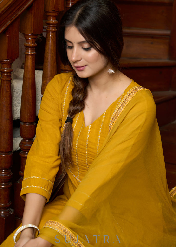 Graceful delicate mustard cotton kurta with a lace yoke and matching pants - Dupatta Optional