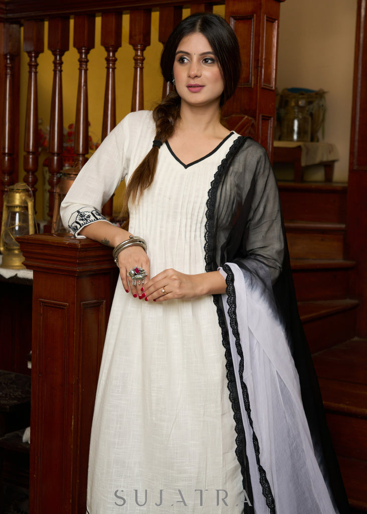 Elegant off-white cotton kurta adorned with intricate embroidery complimeted by matching pants - Dupatta Optional