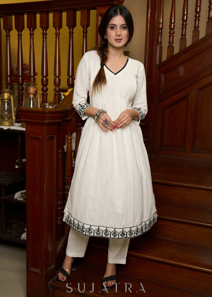 Elegant off-white cotton kurta adorned with intricate embroidery complimeted by matching pants - Dupatta Optional