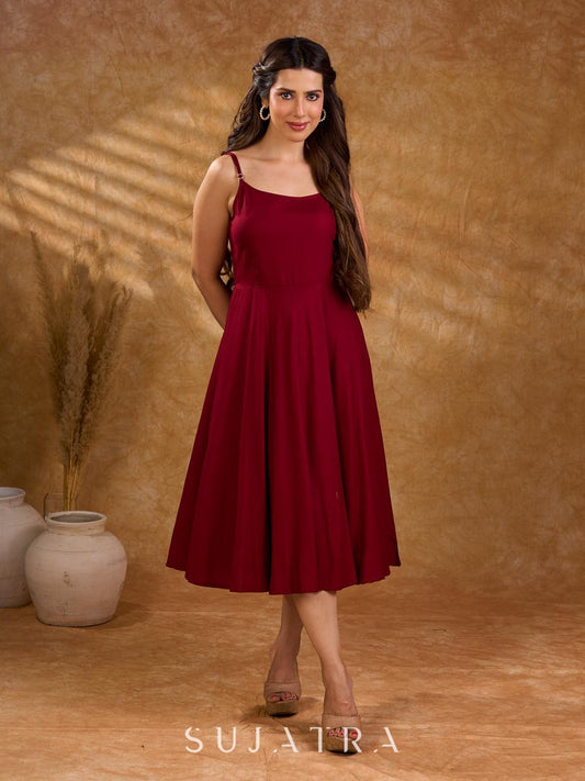 Elegant maroon slip dress in rayon, bias silhouette, graceful movement, breathable comfort, and sleek modern feminine appeal.
