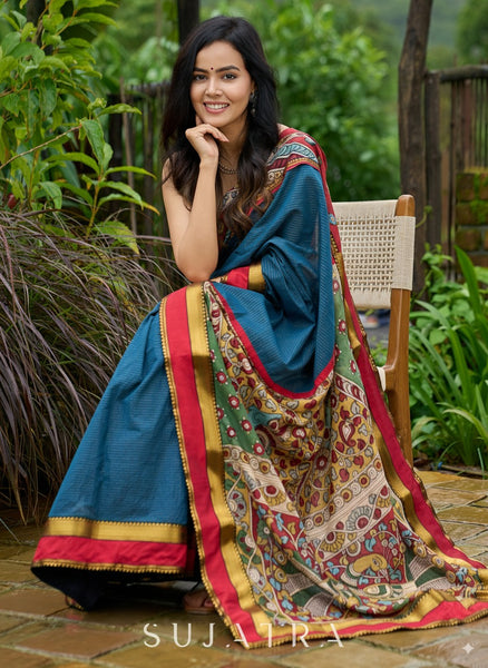 Elegant striped cotton saree in teal, enriched with hand-painted Kalamkari pallu